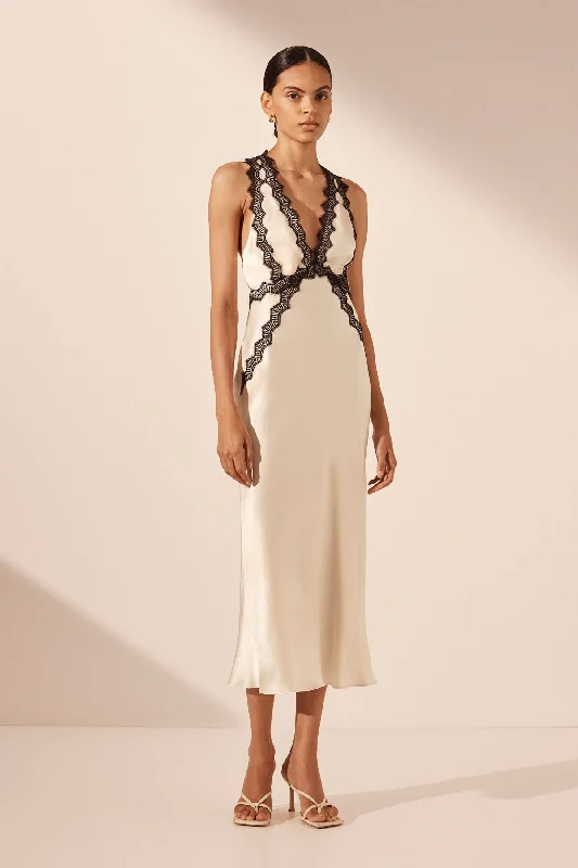 Midi dresses with pleated skirts for a timeless and elegant appeal CAMILLE LACE CROSS BACK MIDI DRESS - CREAM/BLACK Midi dresses with pleated skirts for a timeless and elegant appeal CAMILLE LACE CROSS BACK MIDI DRESS - CREAM/BLACK