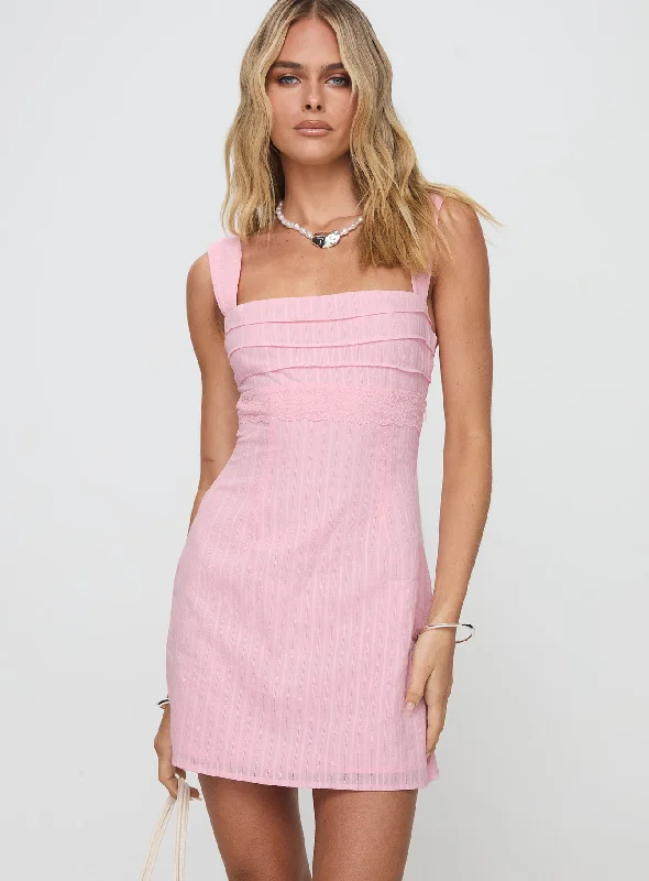Denim mini dresses with distressed detailsAnyone But You Mini Dress Pink